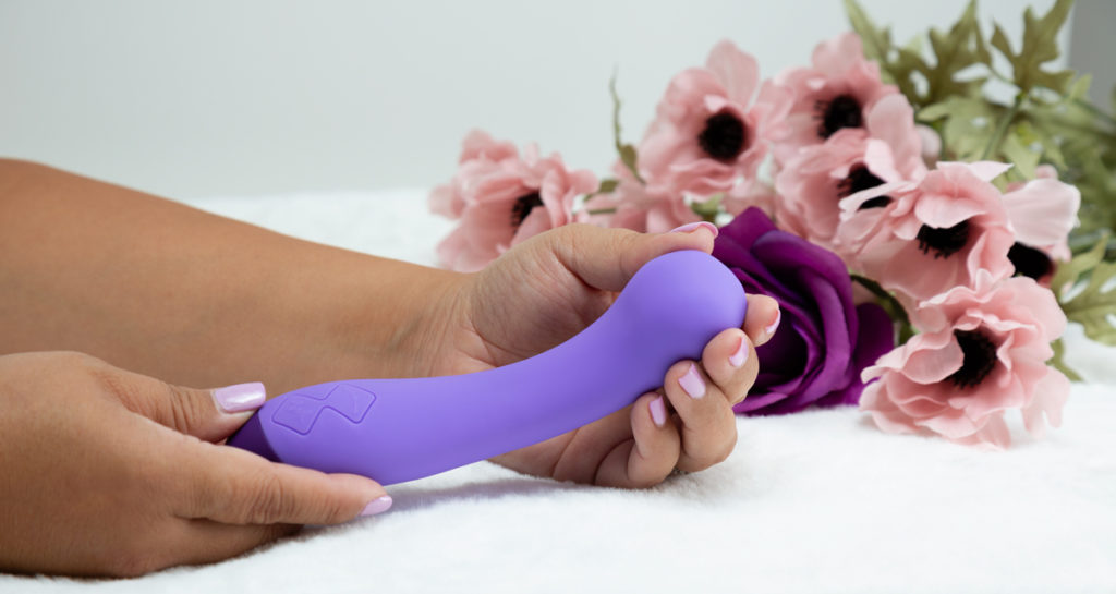 purple silicone vibrator in hands